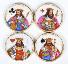 A set of four 19th century French porcelain card game counters, each painted with a king and suit of