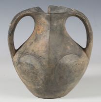 A Chinese Han dynasty greyware pottery 'Swirling Eye' two-handled vase, the flared neck with incised