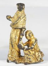 A 13th/14th century copper alloy and gilt decorated religious figure group, cast as a standing