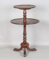 A Victorian mahogany two-tier dumb waiter, raised on a turned stem and tripod legs, height 98cm,