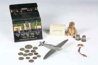 A small group of collectors' items, including a Schuco style teddy bear, a scratch-built aluminium