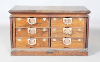 An early 20th century walnut filing cabinet, detailed 'Amberg's Patent', the two doors enclosing six