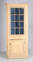 A 19th century pine floor-standing corner cabinet, height 221cm, width 100cm.Buyer’s Premium 29.
