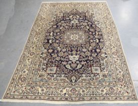 A Nain carpet, Central Persia, late 20th century, the navy blue field with a flowerhead medallion,