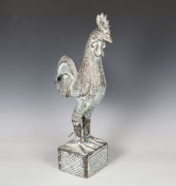 A late 20th century African verdigris bronze model of a cockerel, standing on an integral square