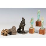 A group of Egyptian antiquities, including three turquoise faience ushabti, height 7.5cm (faults), a