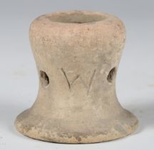 An ancient pottery kiln stacker, the side inscribed with letters, height 5.5cm.Buyer’s Premium 29.4%