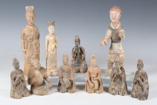 A group of Chinese Han and Tang Dynasty terracotta figures, including six kneeling musicians and two