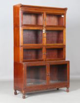 An early 20th century mahogany four-section glazed bookcase, height 144cm, width 89cm, depth 34cm.