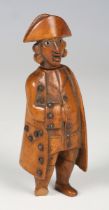 A late 18th/early 19th century carved boxwood novelty figural snuff box, modelled in the form of