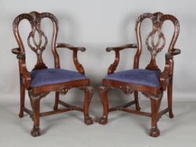 A set of ten modern Queen Anne style hardwood dining chairs with carved backs, comprising two