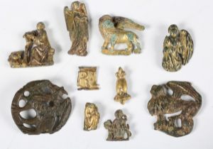 A collection of various early to late medieval mounts and decorative fixings, the majority from