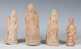 A group of four Hellenistic period terracotta female figures, circa 300 BC, all modelled sitting