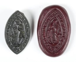 A 13th century bronze vesica seal, the central matrix detailed with a baptism scene, length 3cm,