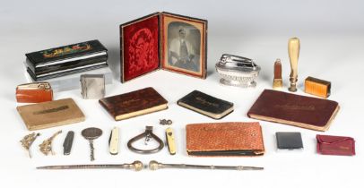 A mixed group of collectors' items, including a Victorian ambrotype portrait in a folding leather