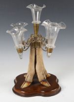 An Edwardian taxidermized five-branch epergne, the brass mount and glass fittings raised on four