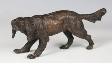 An early 20th century Continental brown patinated cast bronze model of a red setter, probably