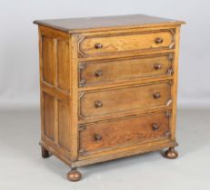 A 20th century Jacobean Revival oak chest of drawers, height 91cm, width 82cm, depth 48.5cm.Buyer’
