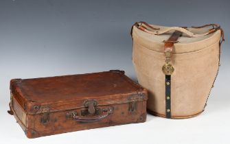 An early 20th century tan-coloured canvas and leather-mounted hat box, width 35cm, together with two