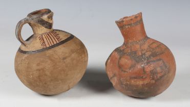 An ancient terracotta vessel, probably pre-Columbian, with black painted geometric surface