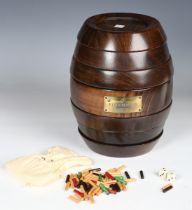 A late 20th century Remy Martin Cognac 'Barrel Game Collection', contained within a turned wooden