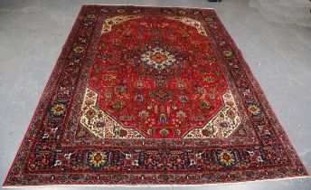 A Tabriz carpet, Central Persia, mid/late 20th century, the red field with an angular medallion,