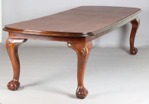 A modern Queen Anne style hardwood extending dining table, fitted with two leaves, raised on