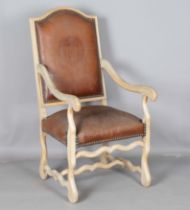 A 20th century French bleached walnut showframe armchair, upholstered in brown leather, height