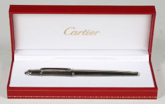 A Cartier silver plated fountain pen, the nib marked '18k-750', the cap with clip and blue cabochon,