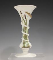 An enamelled opaque white glass vase in the style of Felix Summerly, late 19th century, of trumpet