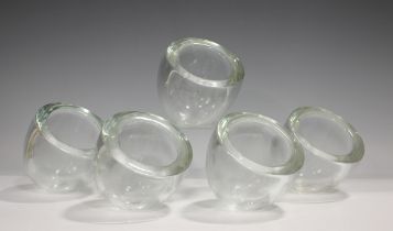 Five Alfredo Barbini Murano thickly walled clear glass bowls, 1980s, of circular shape with angled