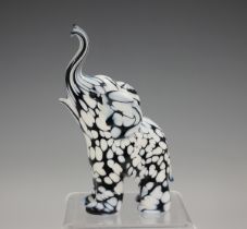A Murano Bianco Nero glass elephant by Archimede Seguso, 1970s, standing with raised trunk, engraved