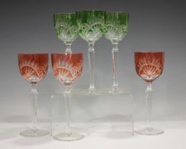A set of six flashed and cut glass hock wine glasses, comprising three green flashed and three