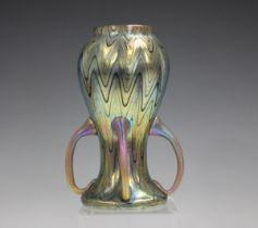A Loetz Phaenomen Rubin four-handled glass vase, circa 1900, of baluster shape applied with four