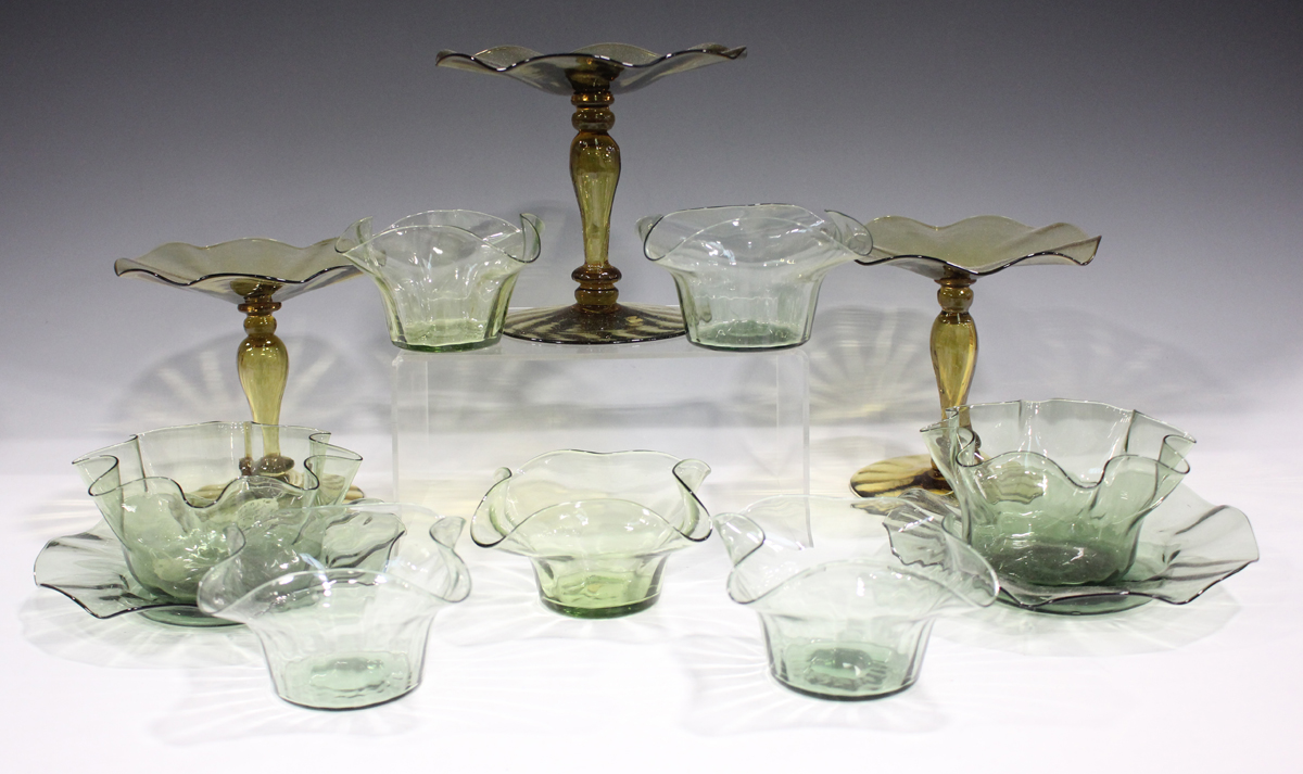 A mixed group of Arts and Crafts glassware, late 19th and early 20th century, mostly in green and