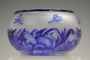 A cameo glass bowl, attributed to Harrach, the clear frosted body overlaid in cobalt blue and carved