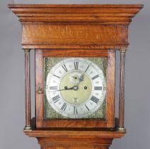 An early 18th century and later oak longcase clock with eight day movement striking on a bell, the