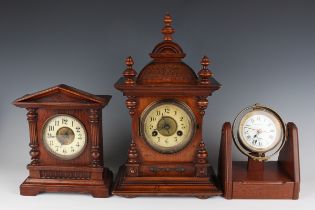 Two 20th century Rotherhams mahogany cased mantel timepieces, heights 16.4cm and 24cm, an oak mantel