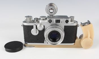 A Leica Ic camera, Nr. 520300, circa 1950-51, with Elmar f=5cm 1:2.8 lens, Nr. 1495102.Buyer’s