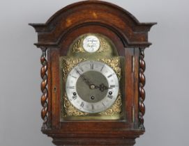 A George V oak diminutive longcase clock with three train movement chiming on gongs, the brass