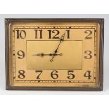 An Art Deco brass rectangular cased easel timepiece, the gilt dial with black Arabic hour
