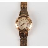 An Omega 18ct gold lady's rear-winding bracelet wristwatch, the signed silvered circular dial with