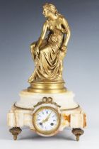 A late 19th century French ormolu and onyx mantel clock with eight day movement striking on a