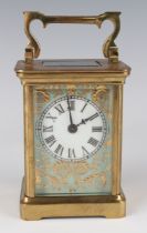 A 20th century brass and porcelain carriage timepiece, the porcelain dial with black Roman hour