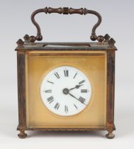 An early 20th century French brass cased carriage timepiece with eight day movement, the circular