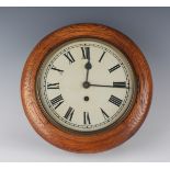 An early 20th century oak circular cased wall timepiece, the 8-inch painted circular dial with black