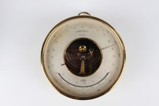 A German Lufft lacquered brass circular cased barometer, the signed 5-inch silvered dial with