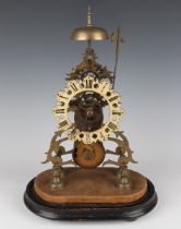 A Victorian brass skeleton clock with eight day single fusee movement striking hours on a bell,