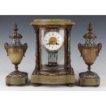 A late 19th/early 20th century French brass, onyx and champlevé enamel clock garniture, the four