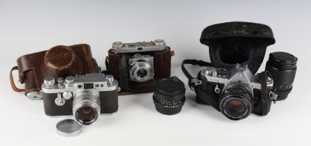 A Leica IIIg camera, Nr. 956309, circa 1959, with Kagaku Topcor-S 1:2 f=5cm lens, together with